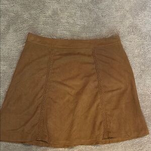 Loveriche ultra suede brown mini skirt with braided detail down front.  EUC